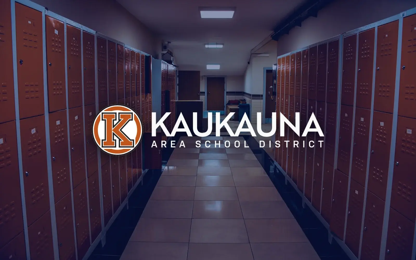 Kaukauna Area School District logo over a school hallway with orange lockers